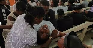 Mourners file into a Church in Haiti where Gangs Killed Dozens of People